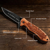 Folding knife with 250th anniversary labeled parts on a wooden for gift 