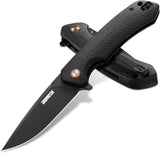 Folding knife with black blade and handle on a white background